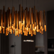 Kindra chandelier lit wood sticks close up
