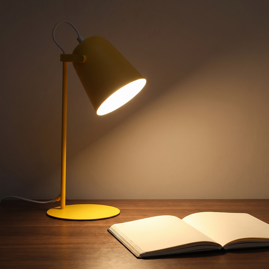 Lumen Arc desk lamp on a walnut desk at night