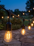 Lumenza outdoor LED string lights over a stone patio