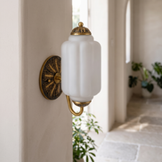 Lisette frosted milk glass wall sconce in daylight