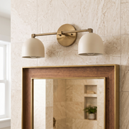 Caldera brushed brass dome vanity wall light in daylight